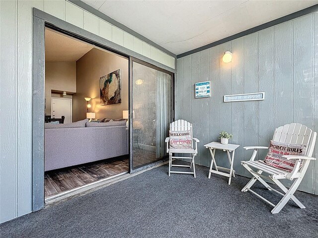 3944 Atrium Dr Unit 4, Orlando, FL 32822 - sitting room featuring carpet floors and wooden walls
