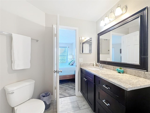 3944 Atrium Dr Unit 4, Orlando, FL 32822 - bathroom featuring vanity, toilet, ensuite bath, and baseboards