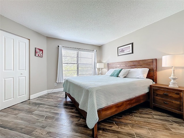 3944 Atrium Dr Unit 4, Orlando, FL 32822 - bedroom with wood finished floors, a textured ceiling, and baseboards
