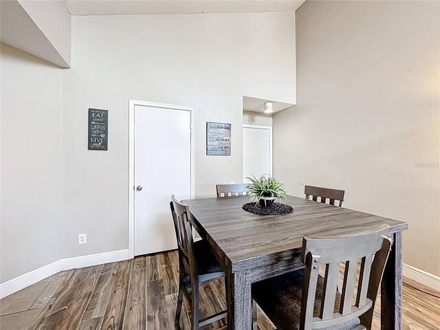 3944 Atrium Dr Unit 4, Orlando, FL 32822 - dining space with baseboards and wood finished floors