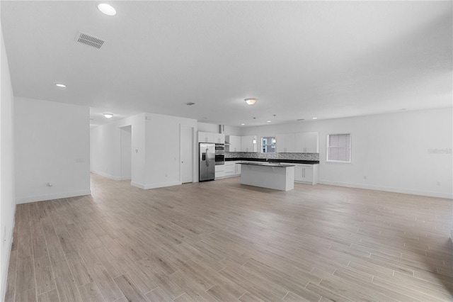 1812 Stoneywood Way, Apopka, FL 32712 - kitchen featuring open floor plan, stainless steel appliances, white cabinets, baseboards, and recessed lighting