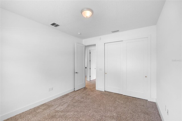 1812 Stoneywood Way, Apopka, FL 32712 - unfurnished bedroom featuring carpet floors, baseboards, and a closet