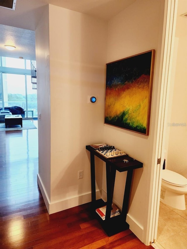 150 E Robinson St Unit 419, Orlando, FL 32801 - hallway with wood finished floors and baseboards
