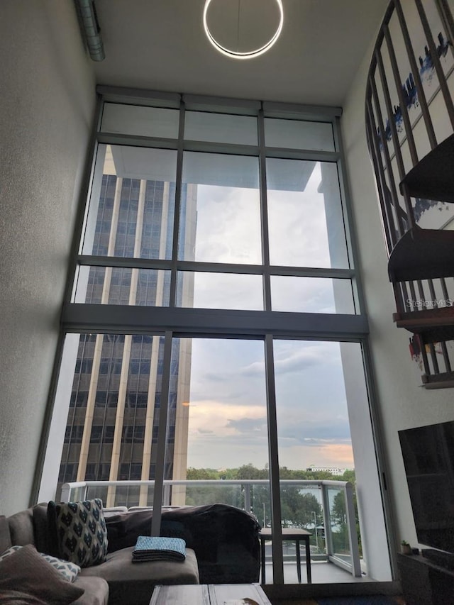 150 E Robinson St Unit 419, Orlando, FL 32801 - living area with floor to ceiling windows and a high ceiling