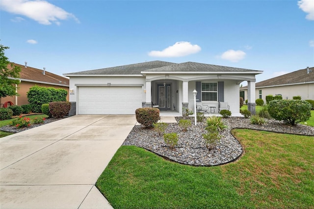 8336 SW 77th Ct, Ocala, FL 34476 - single story home featuring stucco siding, an attached garage, concrete driveway, and covered porch