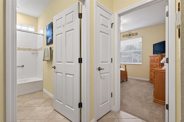8336 SW 77th Ct, Ocala, FL 34476 - ensuite bathroom featuring tile patterned flooring, baseboards, vanity, and bathing tub / shower combination