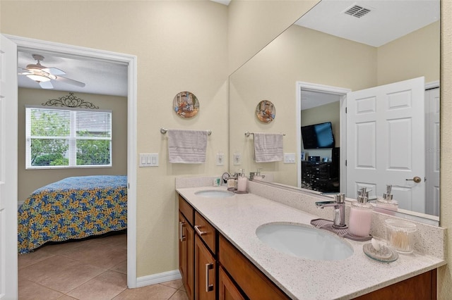 8336 SW 77th Ct, Ocala, FL 34476 - ensuite bathroom featuring double vanity, tile patterned floors, a ceiling fan, and baseboards