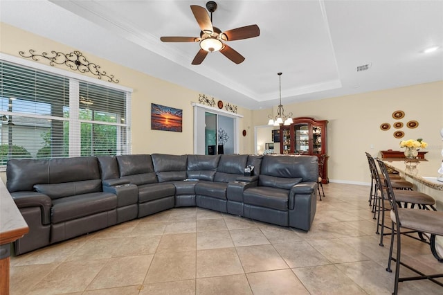 8336 SW 77th Ct, Ocala, FL 34476 - living room with a raised ceiling, a chandelier, a ceiling fan, light tile patterned floors, and baseboards