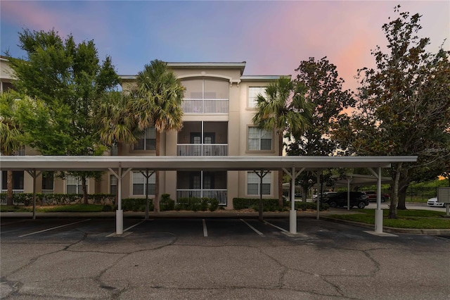 3000 Laurel Park Ln Unit 308, Kissimmee, FL 34741 - property at dusk with covered parking