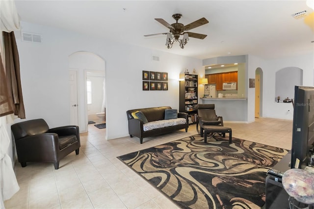 3000 Laurel Park Ln Unit 308, Kissimmee, FL 34741 - living area with arched walkways, a ceiling fan, light tile patterned floors, and recessed lighting