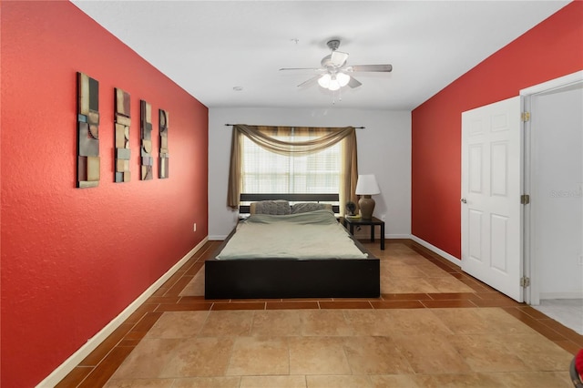 3000 Laurel Park Ln Unit 308, Kissimmee, FL 34741 - tiled bedroom with a ceiling fan and baseboards