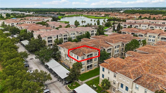 3000 Laurel Park Ln Unit 308, Kissimmee, FL 34741 - aerial overview of property's location with a nearby body of water and property parcel outlined