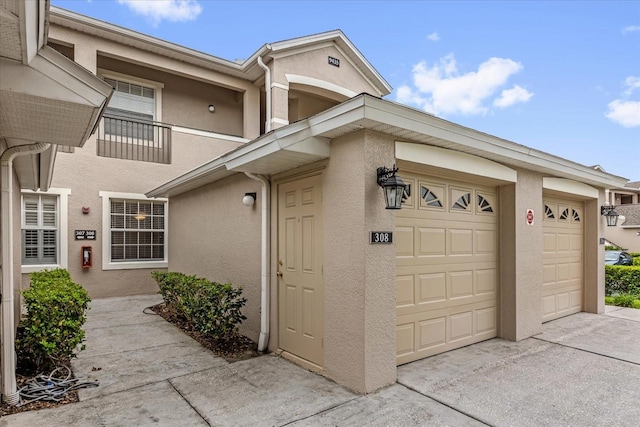 9435 Myrtle Creek Ln Unit 308, Orlando, FL 32832 - garage featuring concrete driveway