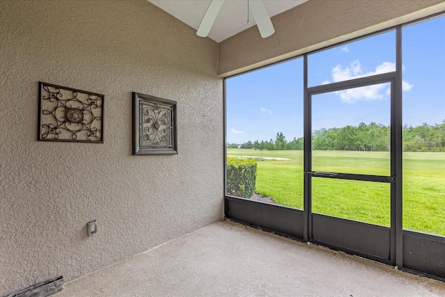 9435 Myrtle Creek Ln Unit 308, Orlando, FL 32832 - unfurnished sunroom featuring ceiling fan, golf course view, and view of scattered trees