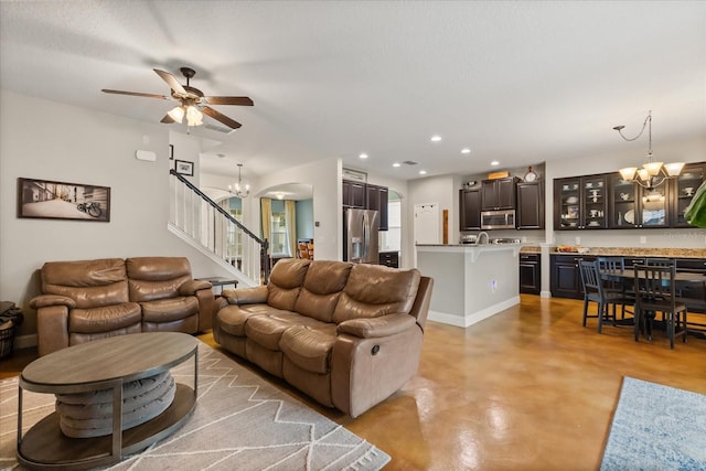 10996 Inside Loop, Orlando, FL 32825 - living area featuring a chandelier, finished concrete floors, stairs, ceiling fan, and recessed lighting
