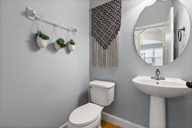 10996 Inside Loop, Orlando, FL 32825 - bathroom with toilet and baseboards