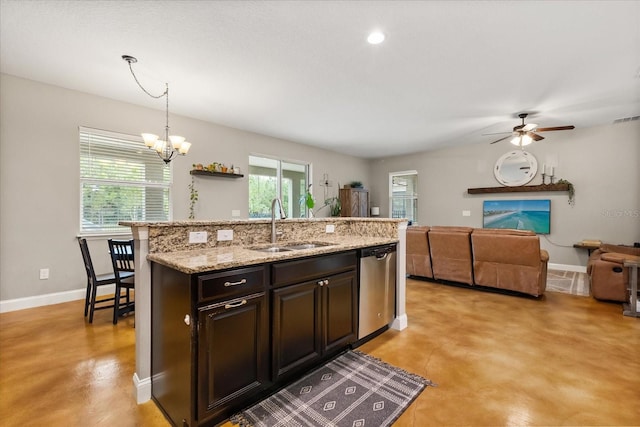 10996 Inside Loop, Orlando, FL 32825 - kitchen with dishwasher, finished concrete flooring, a chandelier, and a kitchen island with sink