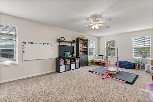 10996 Inside Loop, Orlando, FL 32825 - exercise area with a ceiling fan and carpet floors