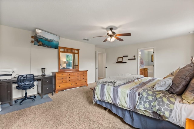 10996 Inside Loop, Orlando, FL 32825 - carpeted bedroom with an office area, ceiling fan, and connected bathroom