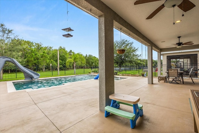 10996 Inside Loop, Orlando, FL 32825 - fenced backyard featuring a ceiling fan and a patio area