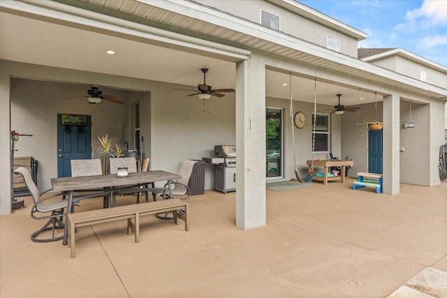 10996 Inside Loop, Orlando, FL 32825 - view of patio / terrace featuring a ceiling fan, a grill, and outdoor dining space