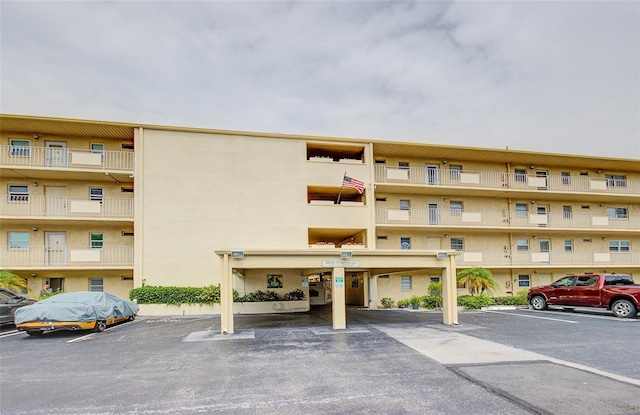 2615 NE 3rd Ct Unit 416, Boynton Beach, FL 33435 - view of apartment building / complex featuring uncovered parking