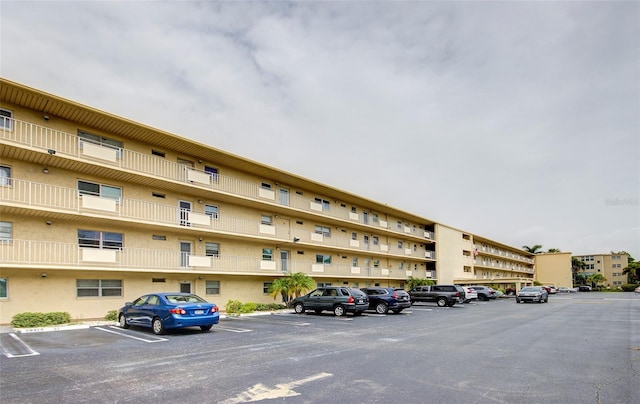 2615 NE 3rd Ct Unit 416, Boynton Beach, FL 33435 - view of apartment building / complex featuring uncovered parking