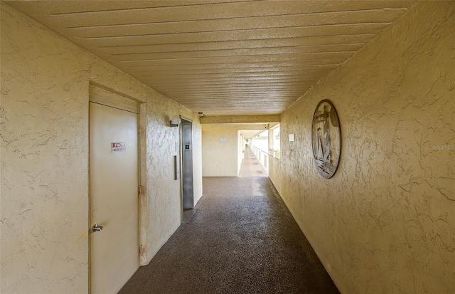 2615 NE 3rd Ct Unit 416, Boynton Beach, FL 33435 - corridor with wood ceiling and elevator