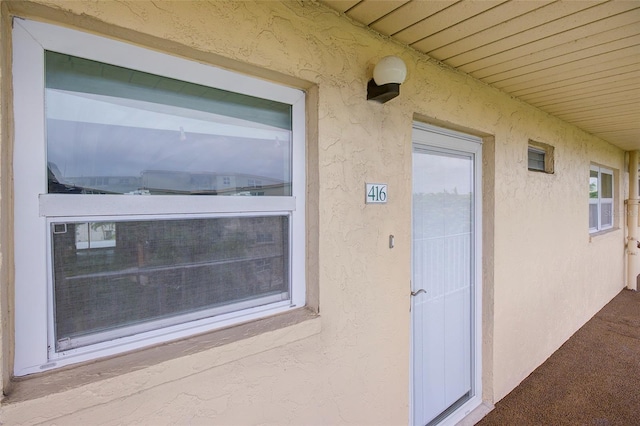 2615 NE 3rd Ct Unit 416, Boynton Beach, FL 33435 - doorway to property featuring stucco siding
