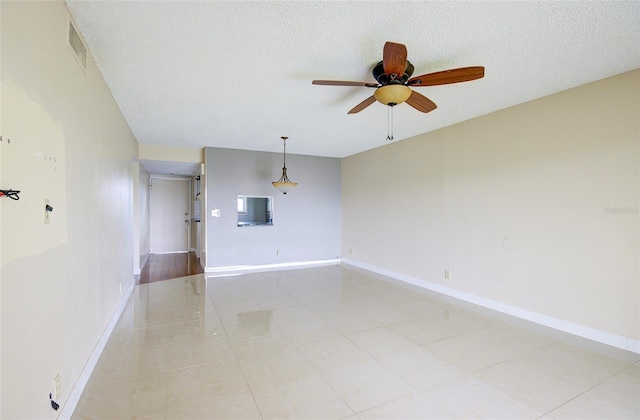 2615 NE 3rd Ct Unit 416, Boynton Beach, FL 33435 - spare room with ceiling fan, baseboards, a textured ceiling, and light tile patterned flooring