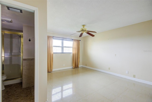 2615 NE 3rd Ct Unit 416, Boynton Beach, FL 33435 - spare room with a ceiling fan, baseboards, and light tile patterned flooring