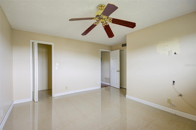 2615 NE 3rd Ct Unit 416, Boynton Beach, FL 33435 - unfurnished room with a ceiling fan, baseboards, and a textured ceiling