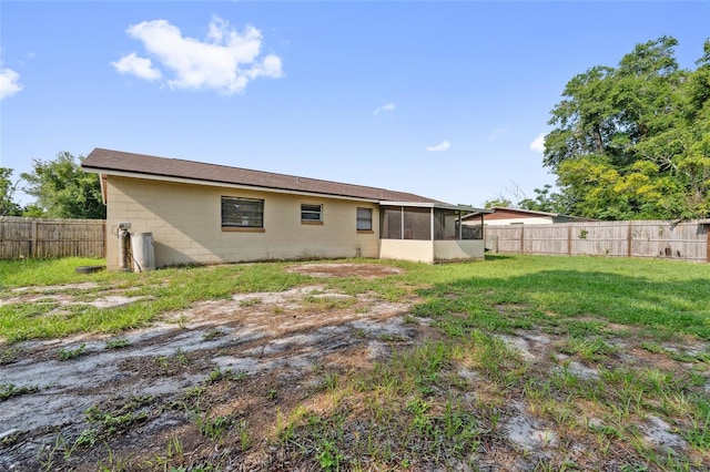 510 Peach Tree Ln, Altamonte Springs, FL 32701 - rear view of house featuring a sunroom, a fenced backyard, and concrete block siding