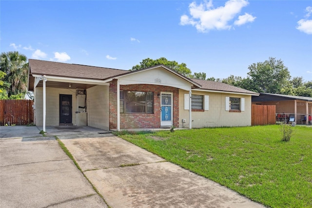 510 Peach Tree Ln, Altamonte Springs, FL 32701 - view of front of home with driveway, an attached carport, and brick siding