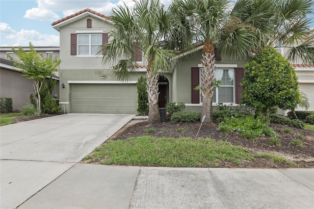 7033 Oakwood St, Davenport, FL 33837 - view of front of property featuring stucco siding, concrete driveway, and a garage