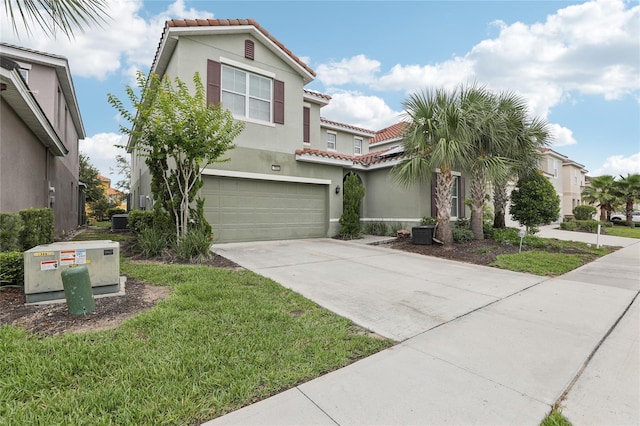 7033 Oakwood St, Davenport, FL 33837 - mediterranean / spanish-style house with a tile roof, a garage, and stucco siding