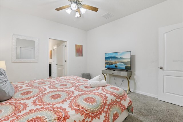 7033 Oakwood St, Davenport, FL 33837 - bedroom with carpet floors, ceiling fan, and baseboards