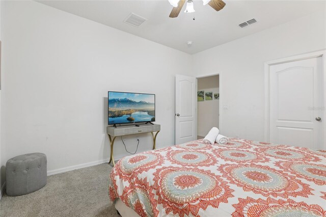 7033 Oakwood St, Davenport, FL 33837 - bedroom with carpet floors, baseboards, and a ceiling fan