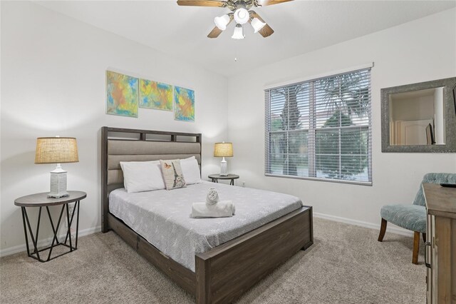 7033 Oakwood St, Davenport, FL 33837 - carpeted bedroom featuring baseboards and a ceiling fan