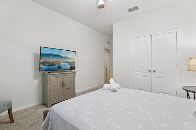 7033 Oakwood St, Davenport, FL 33837 - carpeted bedroom featuring a closet, baseboards, and ceiling fan