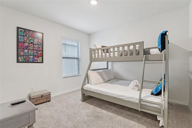 7033 Oakwood St, Davenport, FL 33837 - bedroom with carpet flooring and baseboards