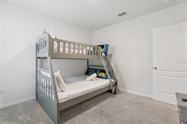 7033 Oakwood St, Davenport, FL 33837 - bedroom with carpet flooring and baseboards