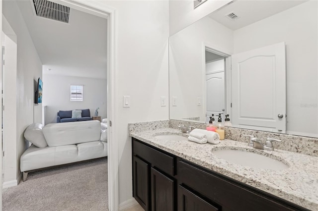 7033 Oakwood St, Davenport, FL 33837 - bathroom featuring ensuite bath, double vanity, and baseboards