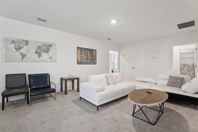 7033 Oakwood St, Davenport, FL 33837 - carpeted living area featuring recessed lighting