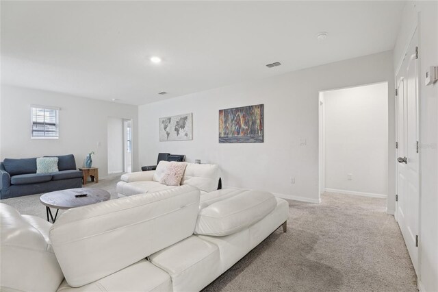 7033 Oakwood St, Davenport, FL 33837 - living area featuring carpet flooring and baseboards
