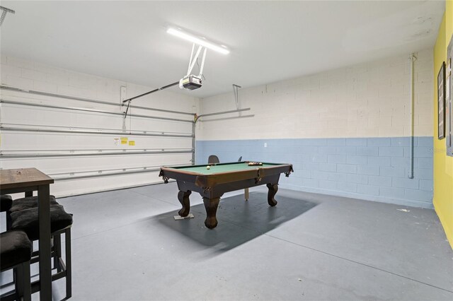 7033 Oakwood St, Davenport, FL 33837 - garage with a garage door opener and concrete block wall