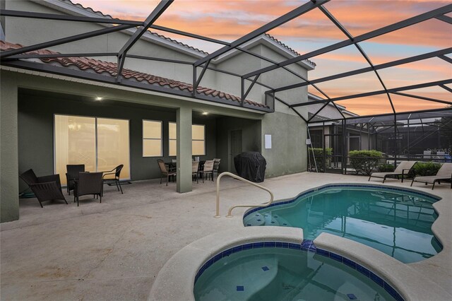 7033 Oakwood St, Davenport, FL 33837 - view of pool with a patio area, outdoor dining space, grilling area, and a lanai