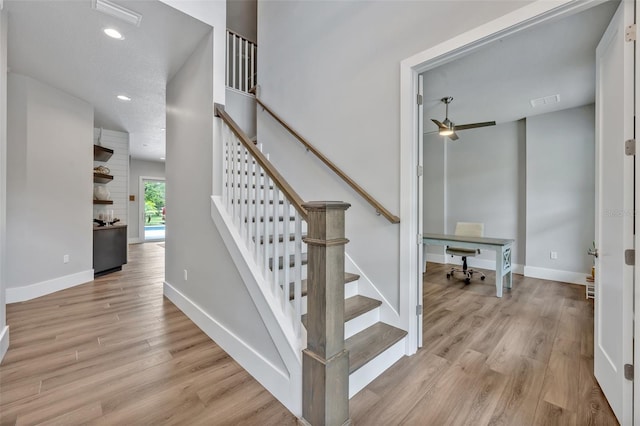 2459 Mcgregor Oaks Ln, Deland, FL 32720 - staircase featuring wood finished floors, a ceiling fan, baseboards, and recessed lighting