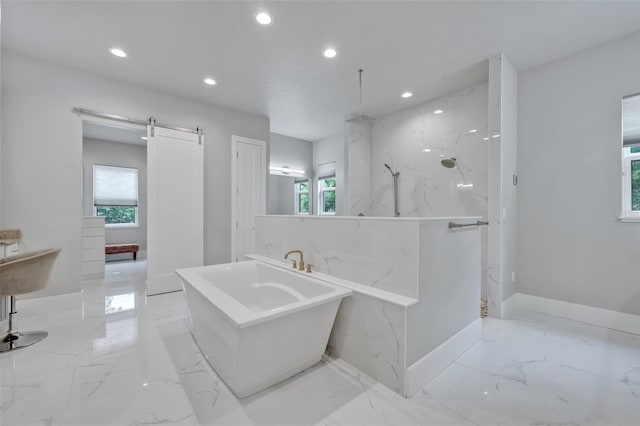 2459 Mcgregor Oaks Ln, Deland, FL 32720 - full bathroom with marble tiled floors, recessed lighting, a soaking tub, a marble finish shower, and baseboards
