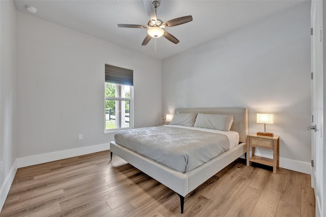 2459 Mcgregor Oaks Ln, Deland, FL 32720 - bedroom with light wood-type flooring, baseboards, and ceiling fan